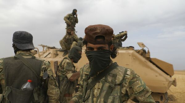 Сирийские боевики, поддерживаемые Турцией, во время боевых действий недалеко от города Рас-эль-Айн (19 октября 2020). Сирия - Sputnik Армения