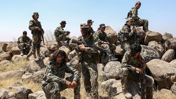 Поддерживаемые Турцией сирийские боевики во время военных учений возле удерживаемого повстанцами города Эр-Рай на севере провинции Алеппо (24 июля 2019). Сирия - Sputnik Армения