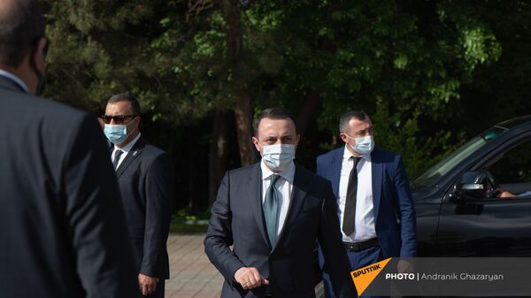 Премьер-министр Грузии Ираклий Гарибашвили во время посещения Мемориала Цицернакаберд (12 мая 2021). Еревaн - Sputnik Արմենիա