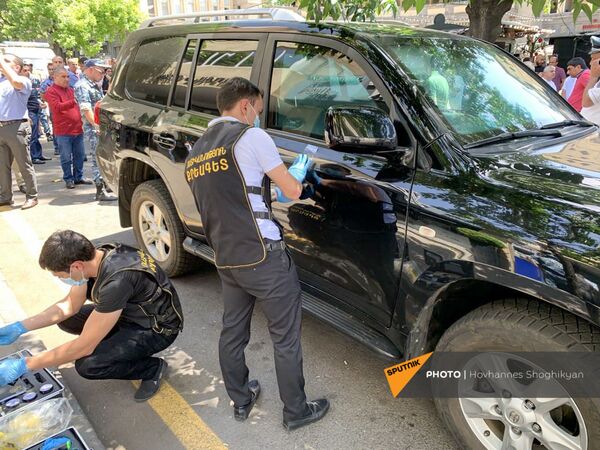Криминалисты  за работой на месте преступления улице Абовяна (2 июня 2021). Еревaн - Sputnik Армения