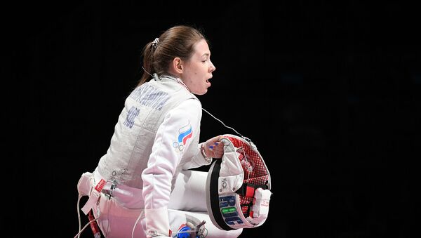 Российская спортсменка, член сборной России по фехтованию Марта Мартьянова в финальном поединке по фехтованию на рапирах во время командного первенства среди женщин на XXXII летних Олимпийских играх (29 июля 2021). Токио - Sputnik Армения