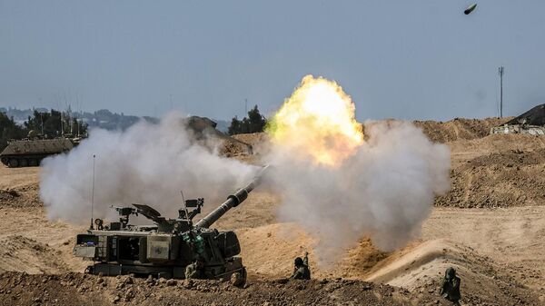 Израильское артиллерийское подразделение ведет огонь по сектору Газа (13 октября 2023). Израиль - Sputnik Армения