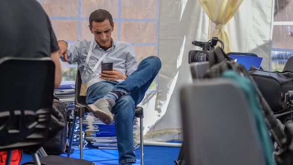 Работа журналистов в пресс-центре во время заседания Высшего Евразийского Экономического Совета (1 октября 2019). Еревaн - Sputnik Армения