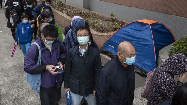 Очередь за защитными масками на одной из улиц в Гонконге. - Sputnik Армения