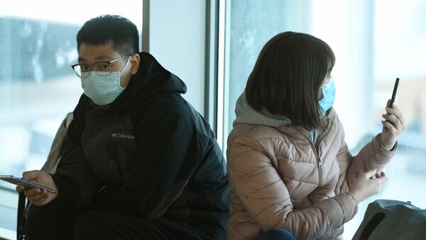 Пассажиры в медицинских масках в аэропорту Шереметьево - Sputnik Արմենիա